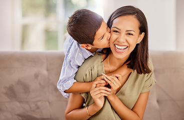 Image showing Kiss, mother and child with hug for love, care and gratitude on mothers day on the sofa of the living room in their house. Portrait of a happy, young and mom with a smile for affection from her kid