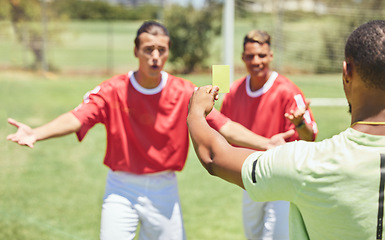 Image showing Man, soccer player and yellow card from referee for sports foul, misconduct or unfair play on the field. Confused men in soccer match getting a warning, sign or penalty for fail in football game law