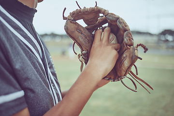 Image showing Baseball player, hands or ball in mitt on grass field for fitness, workout and training in game, match and competition. Zoom, baseball glove and sports athlete in energy exercise for softball pitcher