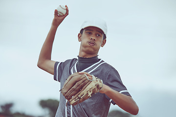 Image showing Baseball, sports and fitness with a man athlete throwing a ball during a game or match outside. Workout, training and exercise with a male baseball player playing a competitive sport for health