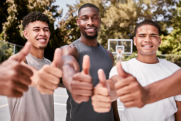 Image showing Thumbs up, sport teamwork and success hand sign of black people on a basketball court. Happy, winner and smile of a basketball, sports and training team gesture with motivation and game support