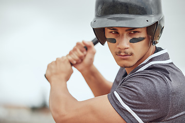 Image showing Focus, baseball and athlete with a bat on a field ready for the game or training with motivation. Mindset, fitness and man playing a softball match, sports exercise or workout on an outdoor pitch.