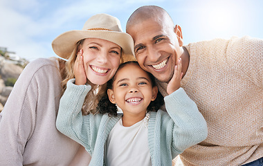 Image showing Family, smile and face portrait in nature on holiday, vacation or summer trip. Diversity, travel and parents, father and mother with girl, love and care, spending quality time together and bonding.