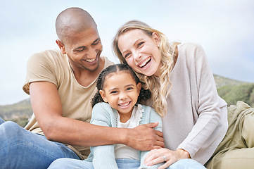 Image showing Happy, family relax and portrait in nature on vacation, holiday or summer trip. Travel, diversity and father, mother and girl, bonding and care, spending quality time together and love with a smile.