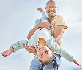 Image showing Happy, summer with father and girl playing together with love, care and happiness. Upside down child with a happy smile with dad spending quality time outdoor having kid fun in the sun on vacation