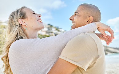 Image showing Beach, hug and interracial love of couple with happy and cheerful smile enjoy vacation in Brazil. Happiness, care and romance of lovers embracing for joyful moment on ocean holiday break.