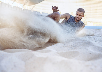 Image showing Man, athlete and sand for long jump, sport and training for sports, field and global competition. Sport, motivation and goal for podium, winning and world record for jumping at arena, stadium or park