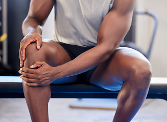 Image showing Knee pain, fitness and sports black man injury at gym after workout exercise. Closeup male athlete orthopedic problem, fibromyalgia emergency and medical arthritis during leg training at health club