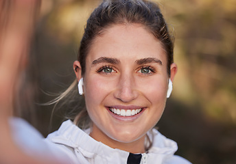 Image showing Earphones, face or woman in fitness selfie, training or workout in nature environment, forest woods or garden park. Zoom, portrait or happy smile for runner in sports influencer photograph with music