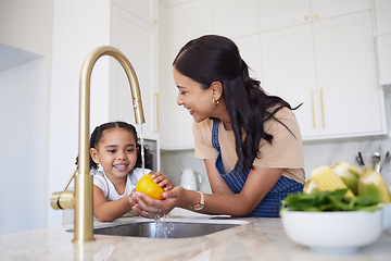 Image showing Vegetable, family and washing with a girl and mother cleaning a pepper in the kitchen of the home together for hygiene. Kids, health and cooking with a woman and daughter using a basin to rinse food