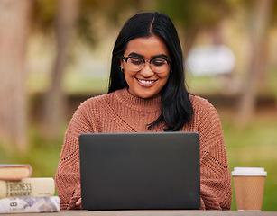 Image showing University, laptop and student studying on campus outdoor research, planning and strategy on project for course work. Scholarship, education or knowledge with college woman learning or reading ebook