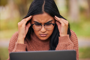 Image showing Study, university and laptop student stress at campus with anxiety for a test. Scholarship woman with headache, frustrated and studying outdoor. Burnout in education, learning and confused about exam