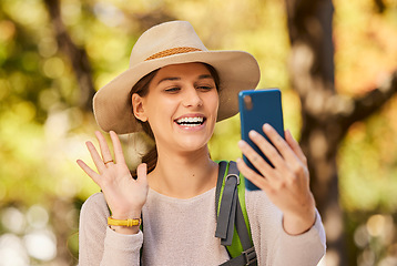 Image showing Nature, hike and phone video call of a woman in nature talking and hiking outdoor. Happy smile of a person wave in a mobile conversation using 5g internet and technology on a tree forest walk