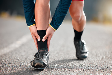 Image showing Run injury, feet and sport runner athlete on a outdoor road feeling ankle and sports pain. Leg muscle strain accident from sports training, running and workout exercise busy with fitness cardio