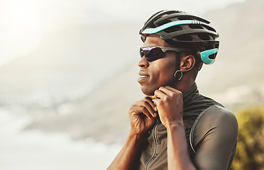 Image showing Mountain, helmet and motorcycle black man in marathon, fitness or sports competition on sky mock up marketing and advertising. Adventure training african athlete with safety gear for outdoor cycling