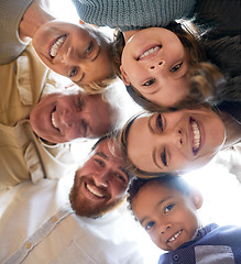 Image showing Family, face and below huddle for support of grandparents, parents and children together with smile, happiness and love circle. Men, women and diversity kids hugging, smiling and happy about adoption