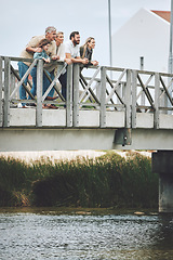 Image showing Family, happy and bridge while standing by river together on holiday, vacation and relax in nature. Group, people and water for bonding, time and love with kids, parents and grandparents in Norway