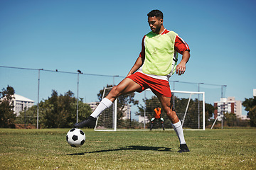 Image showing Soccer, sports and game energy of a man athlete from Israel in a fitness workout and training kick. Exercise, football and healthy cardio of a person with match focus on field grass in summer