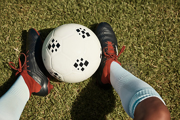 Image showing Soccer ball, grass field and shoes, soccer player and sport, athlete feet and fitness, sports game and training closeup. Soccer, ball and exercise, soccer field and outdoor, green and competitive.