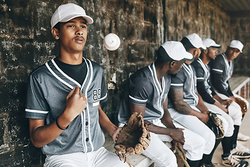 Image showing Baseball, sports and team with a man athlete thinking about the match or game while sitting in the dugout. Exercise, fitness and idea with a male baseball player group ready to play in a match