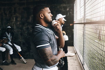 Image showing Baseball, man and watching game with a ball in a sports dugout with his team in club uniform. Latino men watch baseball game on the bench together or waiting to start training, workout or practice