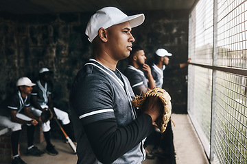 Image showing Baseball, training and coach in dugout, thinking and serious ,planning and sports strategy. Sport, stadium and goal vision by team trainer watching game with baseball player group in background