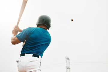 Image showing Baseball player, bat and homerun with sky and baseball for sports, game or contest outdoor in summer. Man, sport and hit in sunshine at stadium, arena or field in competition, match or training