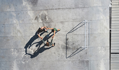 Image showing Soccer, team and high five, sport and fitness, celebrate or motivation with support, soccer player and teamwork in urban space. Athlete celebrating, practice and workout, training overhead and goal.