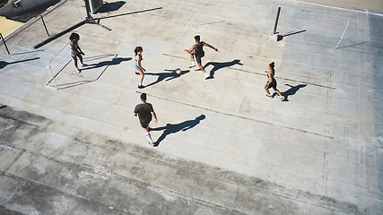 Image showing Soccer, above and women training on a roof during a game, sport competition or event. Athlete, group and team running with a football during a collaboration for sports and professional fitness