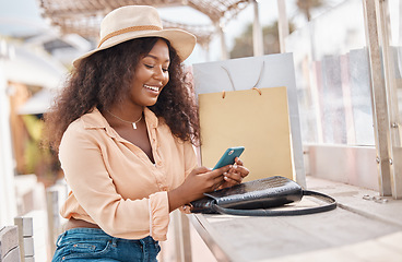 Image showing Shopping bag, phone and black woman on mobile for social media, fashion or happy with 5g app. Beauty, luxury and wealthy girl with smartphone for ecommerce payment onilne while on holiday in miami