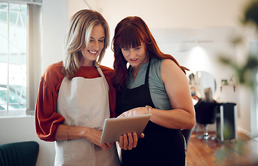 Image showing Business, women and tablet use internet, social media and reading or browse online in shop together at work. Female entrepreneur, girls and with digital device for scroll, planning or startup company