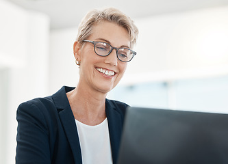 Image showing Laptop, management and design with a female CEO, manager or boss working on a project in her office. Computer, creative and typing with a mature business woman or designer at work in her company