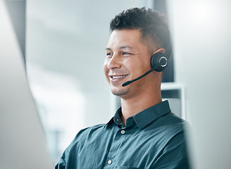 Image showing Consultant, call center and contact us man at computer with smile in office with mic headset. Consulting, sales or support worker male at pc happy in corporate and professional workspace.