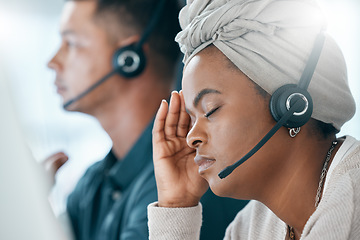 Image showing Headset, call center and black woman with headache, stress and anxious being overworked in office. Frustrated, customer support agent and burnout with depression, pain and migraine sitting at desk.