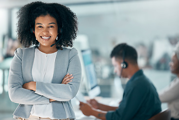 Image showing Call center, support and black woman consulting, working and giving help to people on the web in telemarketing office. Portrait of a customer service agent with arms crossed, pride and smile for crm