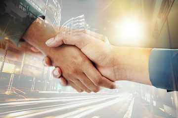 Image showing Business people, shaking hands and city overlay, welcome and thank you of people in collaboration. Double exposure, success and b2b partnership handshake, teamwork or trust, deal or crm agreement.