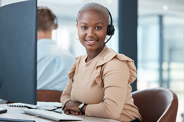 Image showing Contact us, telemarketing and black woman in a call center for customer support, helping and talking to clients. Portrait, smile and happy African consultant working for a telecom company or business