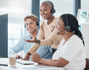 Image showing Training, teamwork and call center team in office on computer working together. Customer service, diversity and coaching manager, leader or employee helping, advise or teaching in company workplace.