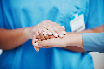 Image showing Hospital nurse, patient support and hands held together with empathy, kindness and compassion. Nursing professional, healthcare wellness clinic and medical counseling a woman sorry for cancer results