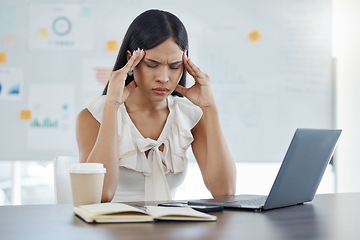 Image showing Headache, stress and burnout with a business woman at work on a laptop at a desk in her office. Computer, compliance and mental health with a female employee suffering from a migraine while working