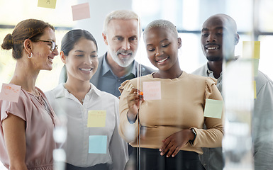 Image showing Business people, team and sticky notes for planning, strategy or brainstorming meeting together at the office. Diverse group of creative workers in collaboration for ideas, pages or schedule tasks.