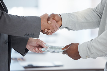 Image showing Handshake, money and crime with a business man taking a bribe in the office for a deal or agreement. Finance, payment and fraud with a male employee shaking hands in a partnership of corruption