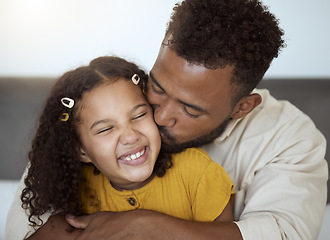 Image showing Love, family and girl and father kiss on a sofa while bonding, relax and hug in a living room in their home together. Happy family, smile and portrait of loving child embrace parent on couch indoors