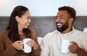 Image showing Couple, coffee and laughing people feeling happiness in a home living room lounge sofa. Happy, funny and smile in the morning of a girlfriend and boyfriend together on a house couch with quality time