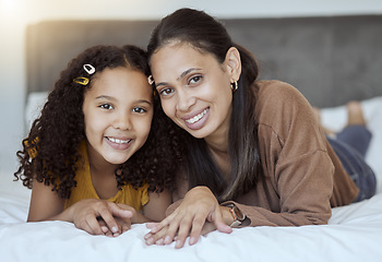 Image showing Mother, girl and happy family home morning on a bedroom bed feeling family love and care. Portrait of a mama and child in a house bonding together with a smile lying with happiness smiling content