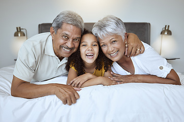 Image showing Girl, grandparents and relax on bed with smile, happy and love with family bonding together in home. Portrait on latino child, senior man and woman laugh, joy and fun together in bedroom on a weeknd