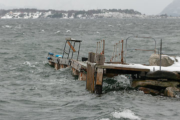 Image showing A dock in rough  the water