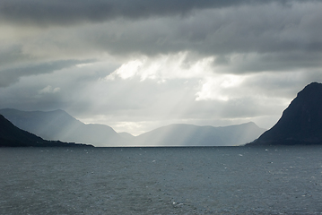 Image showing A body of water with mountains in the background