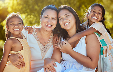 Image showing Women, happy and nature park of a family together with a smile and hug bonding outdoor. Portrait of a mother, grandparent and girl siblings with happiness, love and care feeling positive in a garden