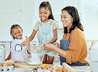 Image showing Happy family cooking, mother and children help mom with egg, wheat flour and bake food in home kitchen. Love, youth kids teamwork on baking and enjoy fun, bonding or quality time helping support mama